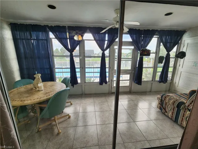 Dining room featuring ceiling fan and light tile patterned floors