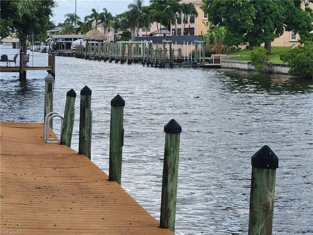 Dock area featuring a water view