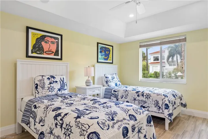 Bedroom featuring light hardwood / wood-style floors and ceiling fan