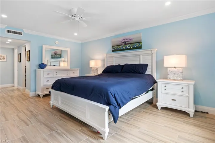 Bedroom featuring ornamental molding and ceiling fan