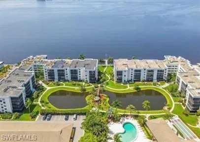Aerial view of a large body of water and apartment complex