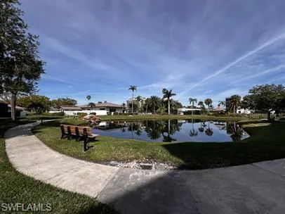 Surrounding community featuring a water view