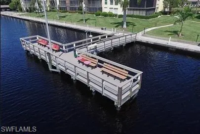 Dock area featuring a water view