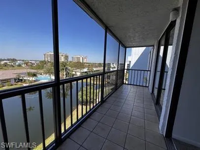 Balcony featuring a sunroom