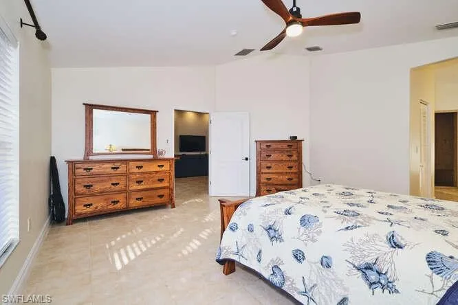 Dining area featuring vaulted ceiling and ceiling fan