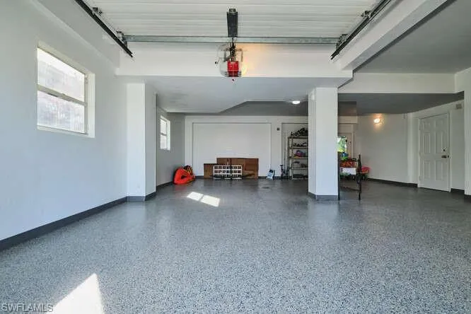 Outdoor pool featuring a sunroom, glass enclosure, and a patio area