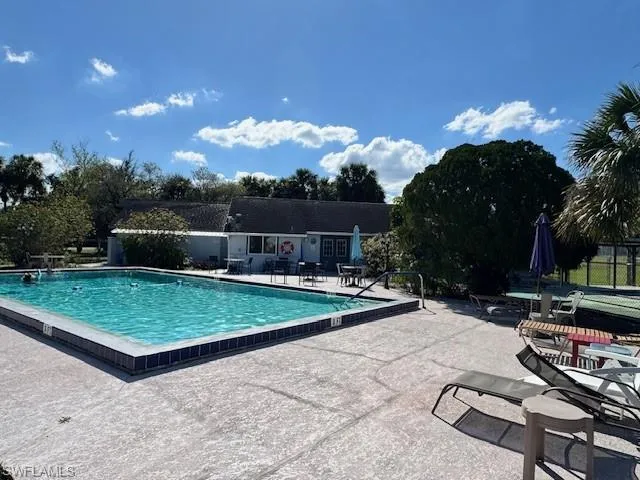 Community pool with a patio area