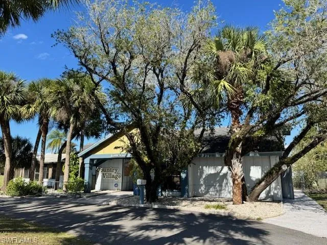 View of front of house with a garage and driveway