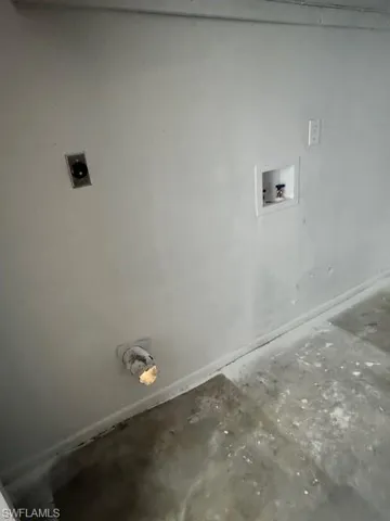 Clothes washing area featuring hookup for a washing machine, baseboards, laundry area, and electric dryer hookup