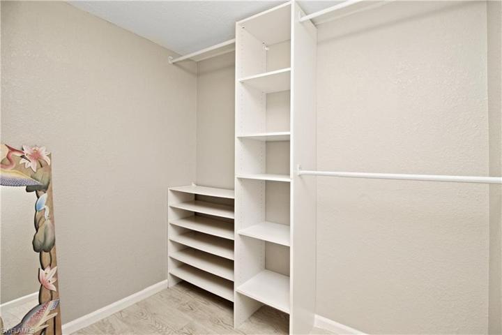 Master walk-in closet with built-in shelving