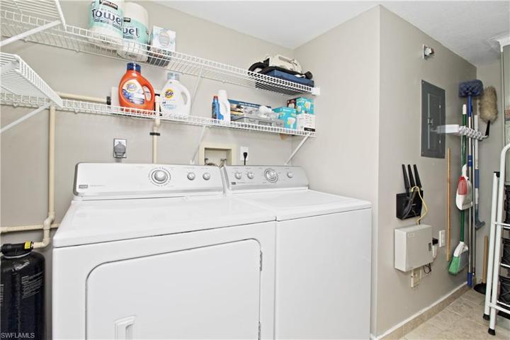 Large laundry with extra storage.