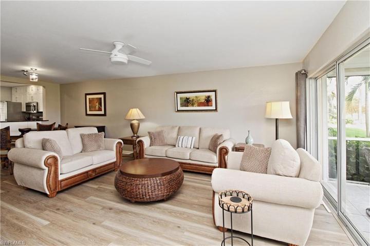 Spacious living room overlooking golf course