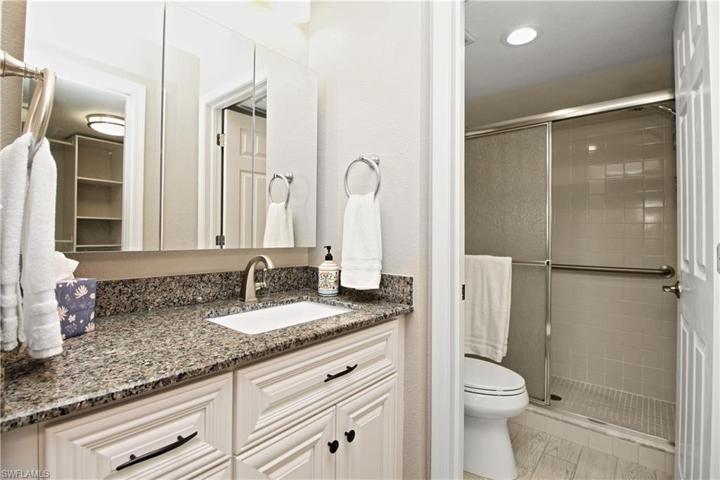 Raised vanity, new counter, large mirrored medicine cabinet, new light fixture