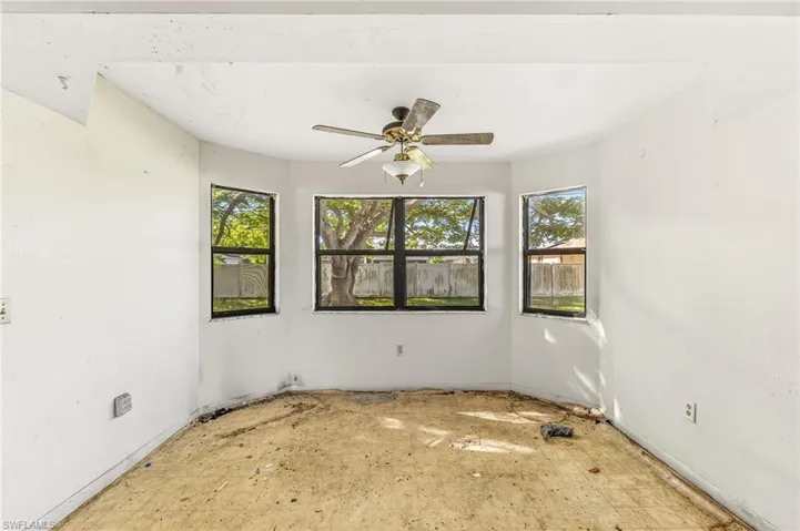 Spare room with ceiling fan