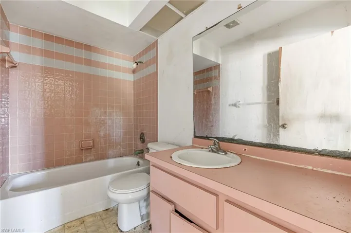Full bathroom featuring washtub / shower combination and vanity