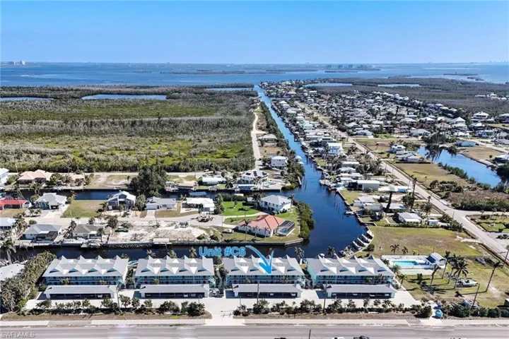 Aerial view of residential area with a nearby body of water