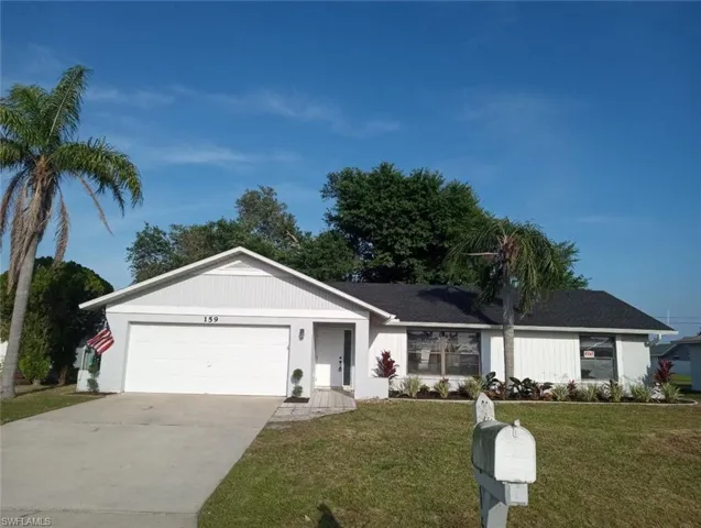 Single-story residence featuring a light gray exterior with white trim