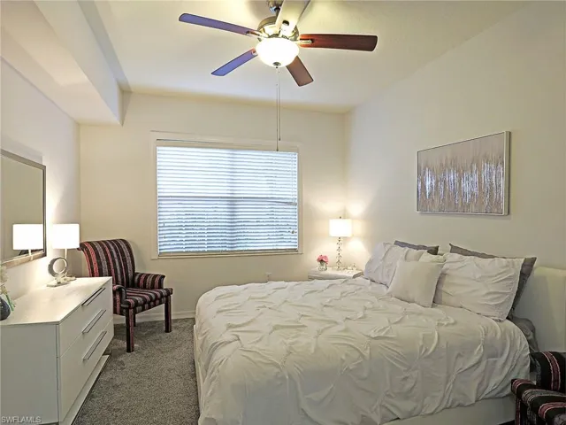 Bedroom featuring carpet and a ceiling fan