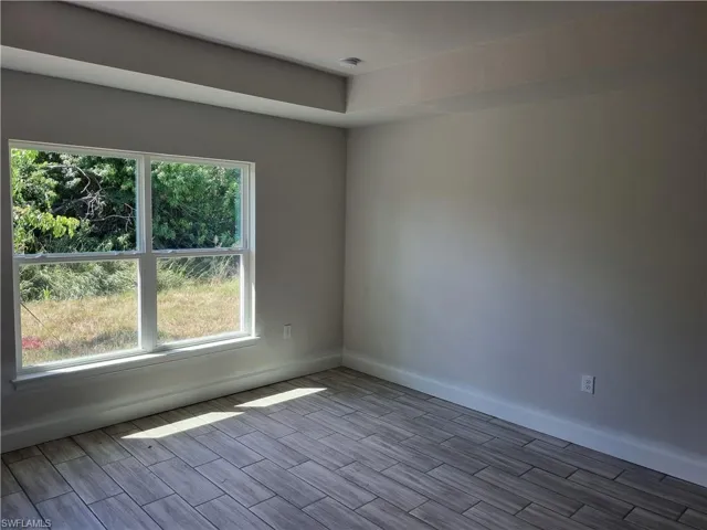 Empty room featuring light wood-type flooring