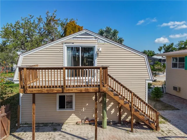 Rear view of garage with studio apartment