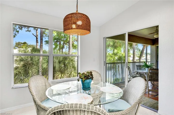 Dining room featuring healthy amount of natural light and lofted ceiling