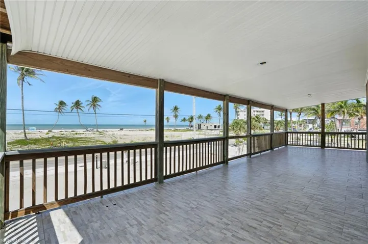 Wooden deck with a water view- Virtually Enhanced