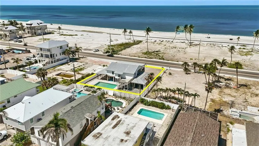Aerial view of property's location with a pool area and property boundaries highlighted- Virtually Enhanced