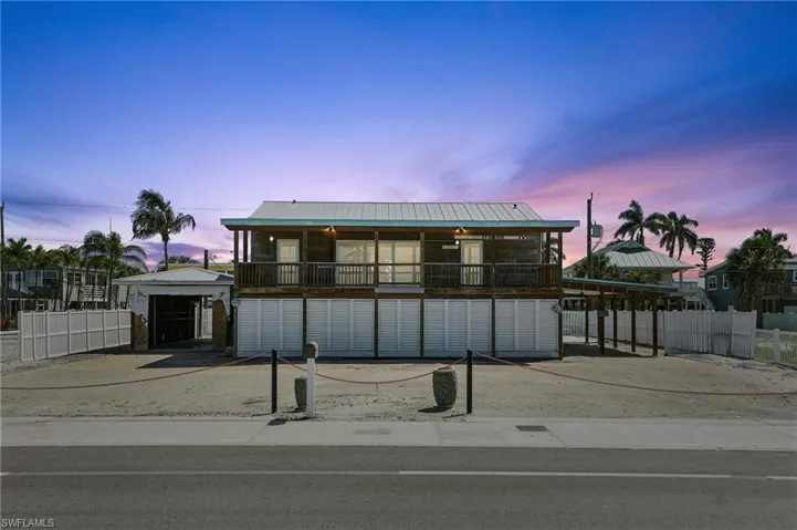 Raised beach house with a metal roof- Virtually Enhanced
