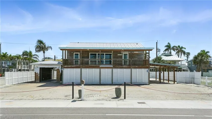 Coastal home featuring a metal roof- Virtually Enhanced