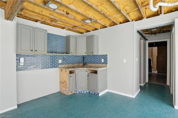 Kitchen with backsplash and light countertops- Virtually Enhanced