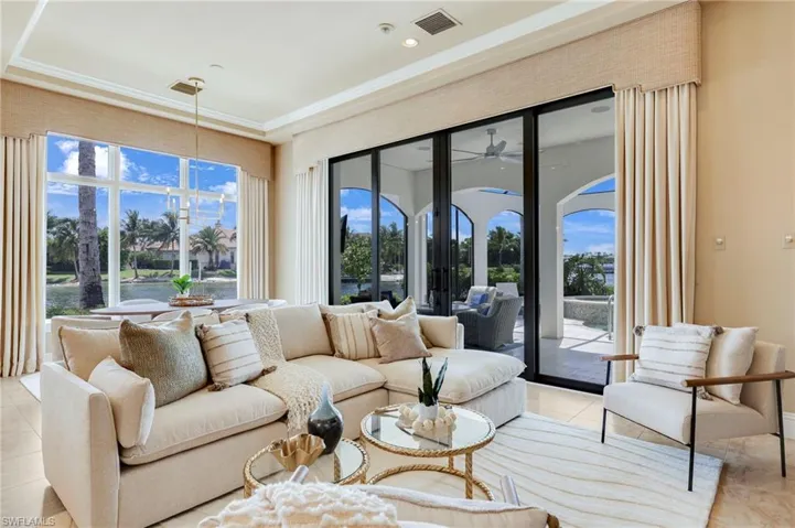 Tiled living room featuring ceiling fan