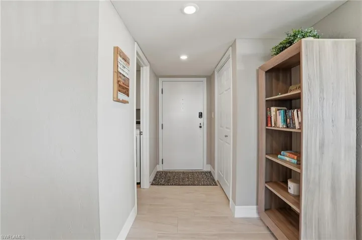 Doorway with baseboards and recessed lighting - Virtually Edited Image