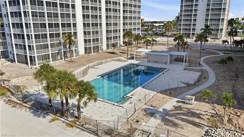 Community pool with a patio area - Virtually Edited Image