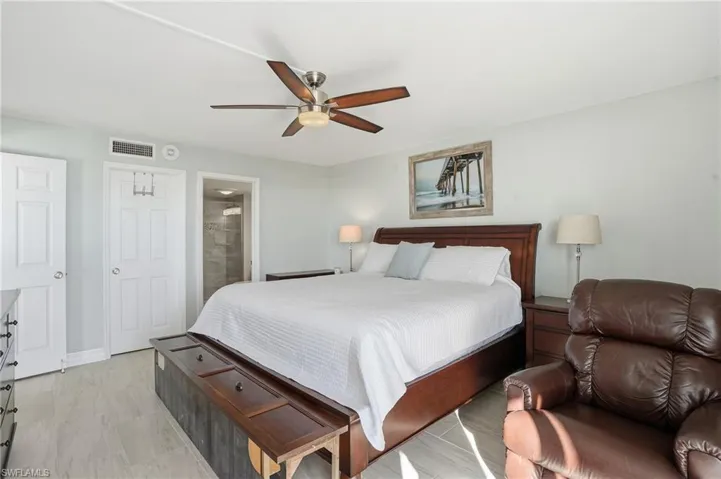 Bedroom with ensuite bathroom and ceiling fan - Virtually Edited Image