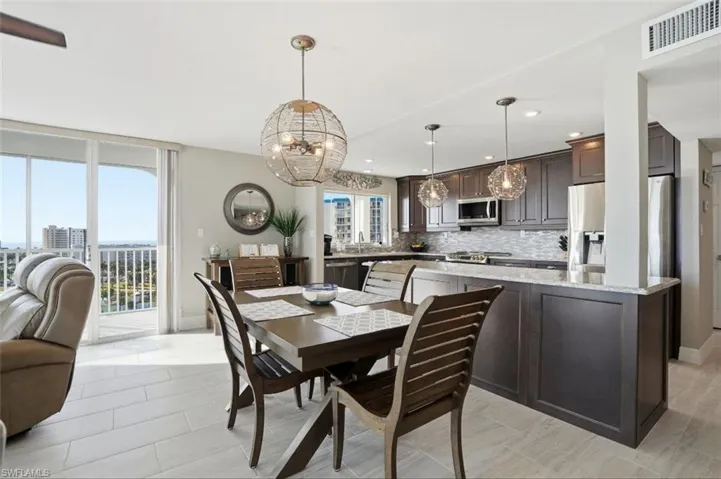 Dining room featuring suspended lighting - Virtually Edited Image