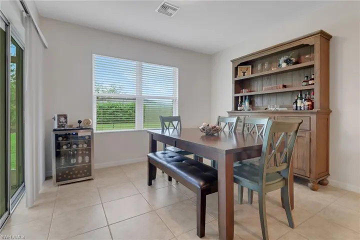 Dining area featuring light tile patterned floors