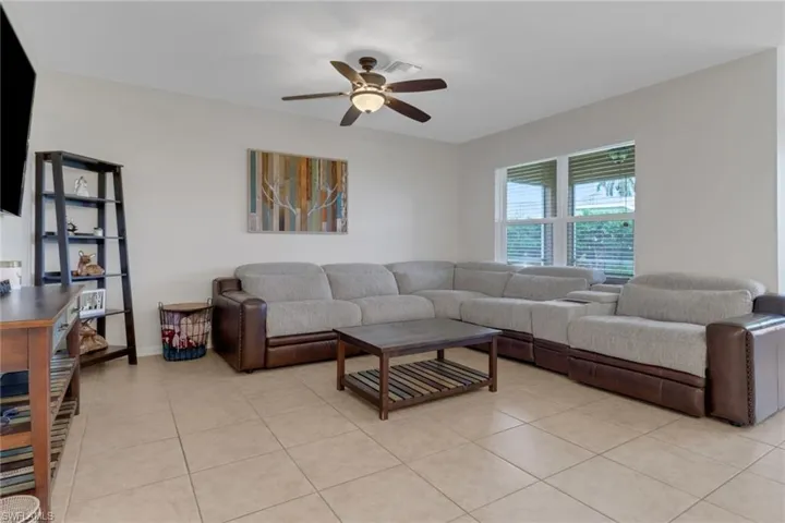 Tiled living room with ceiling fan