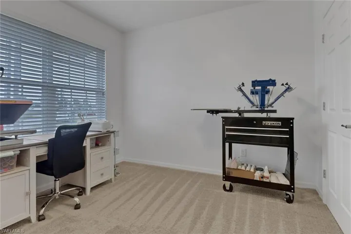 View of carpeted home office