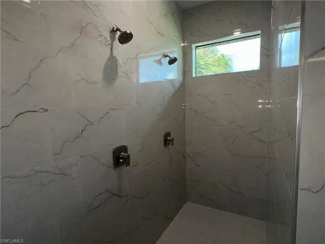 Bathroom with tiled shower