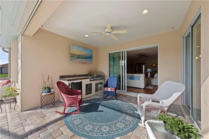 View of patio / terrace with a ceiling fan and area for grilling