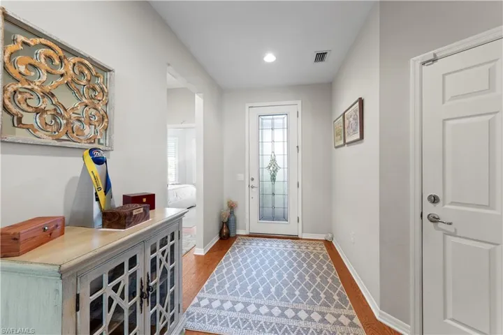 Entryway featuring wood finished floors and recessed lighting