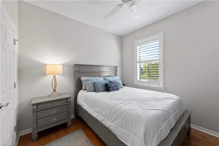 Bedroom featuring wood finished floors and a ceiling fan