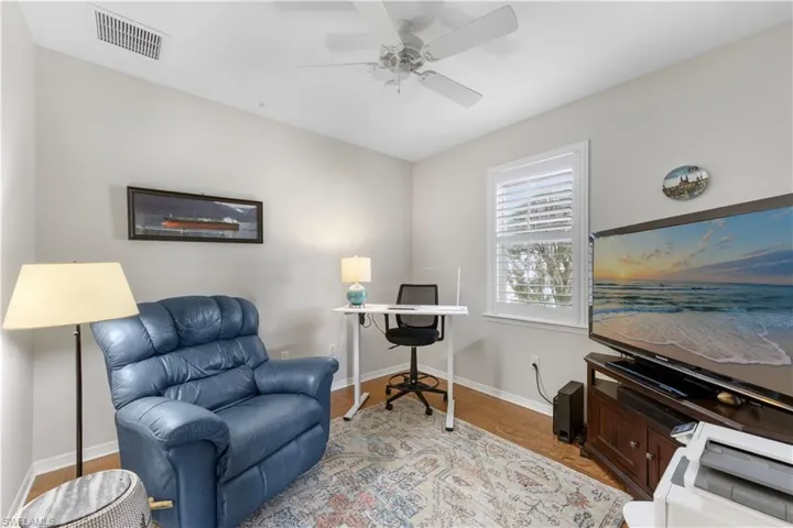 Office featuring ceiling fan and light wood-style floors