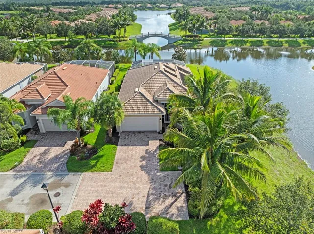 Aerial perspective of suburban area featuring a large body of water