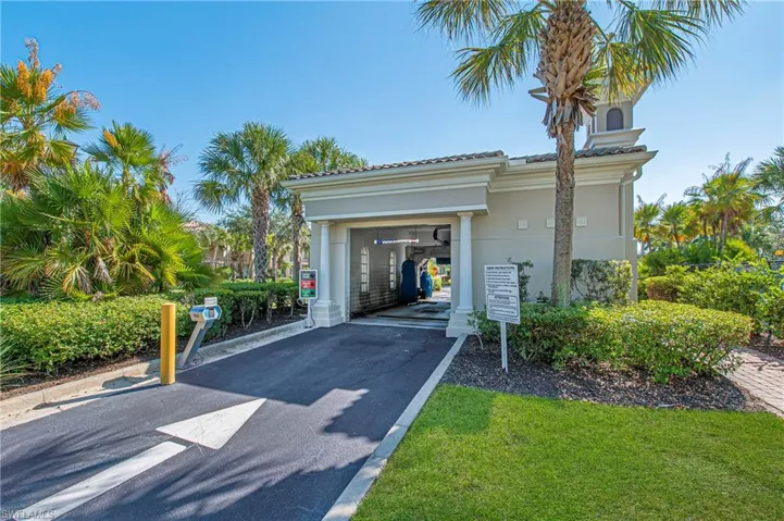 Garage with driveway and a carport