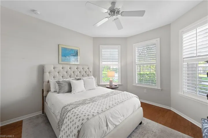 Bedroom with wood finished floors and a ceiling fan