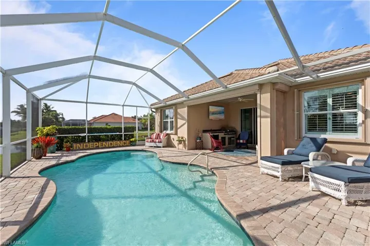 Swimming pool with a patio and ceiling fan
