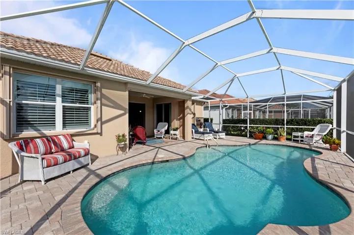 Outdoor pool featuring a patio and a lanai