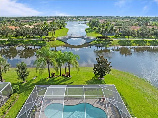 Drone / aerial view of a large body of water and a pool
