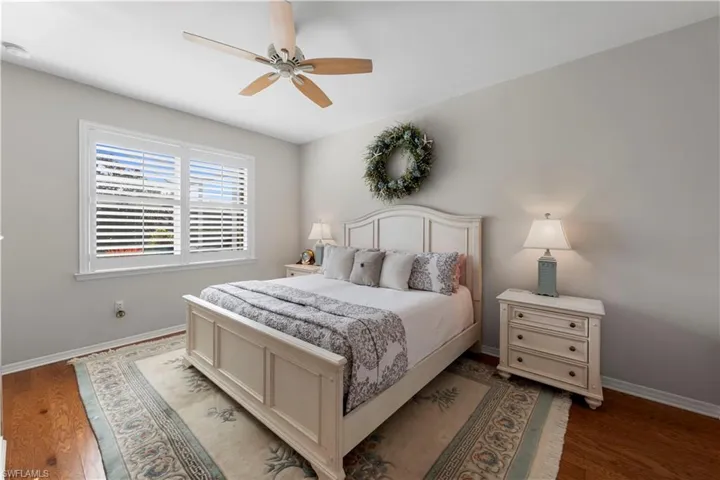 Bedroom with light wood-type flooring and ceiling fan